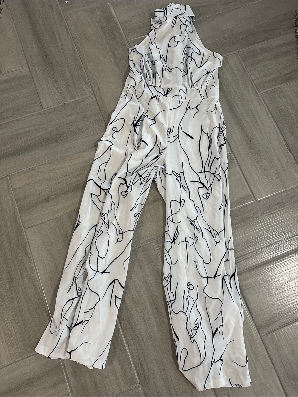 Sleeveless White Jumpsuit w/ Black Abstract Line Print with neck bow back clos
